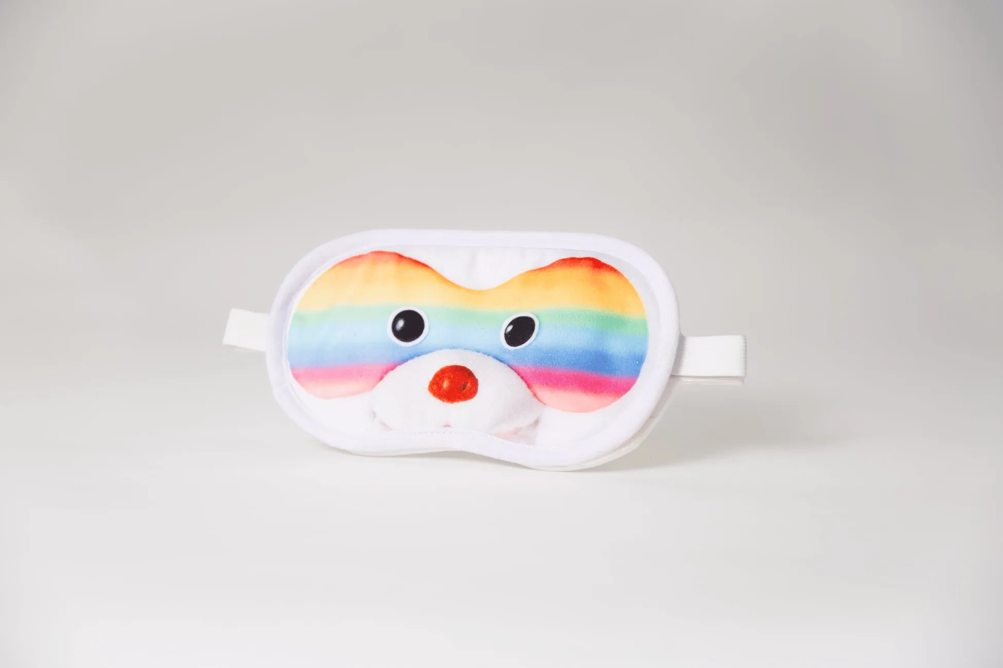 クマの顔が描かれた虹色のアイマスク